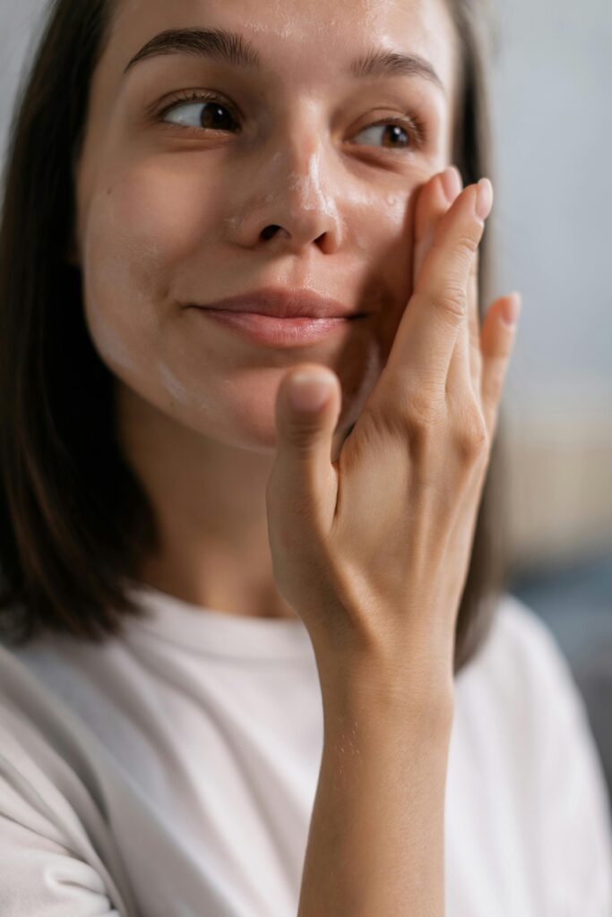 female applying lightweight moisturizer for hydrated skin