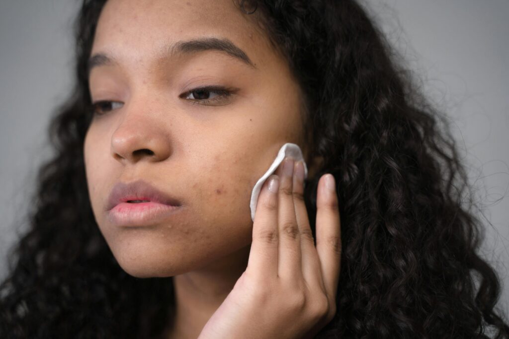 female applying hydrating toner for morning skincare